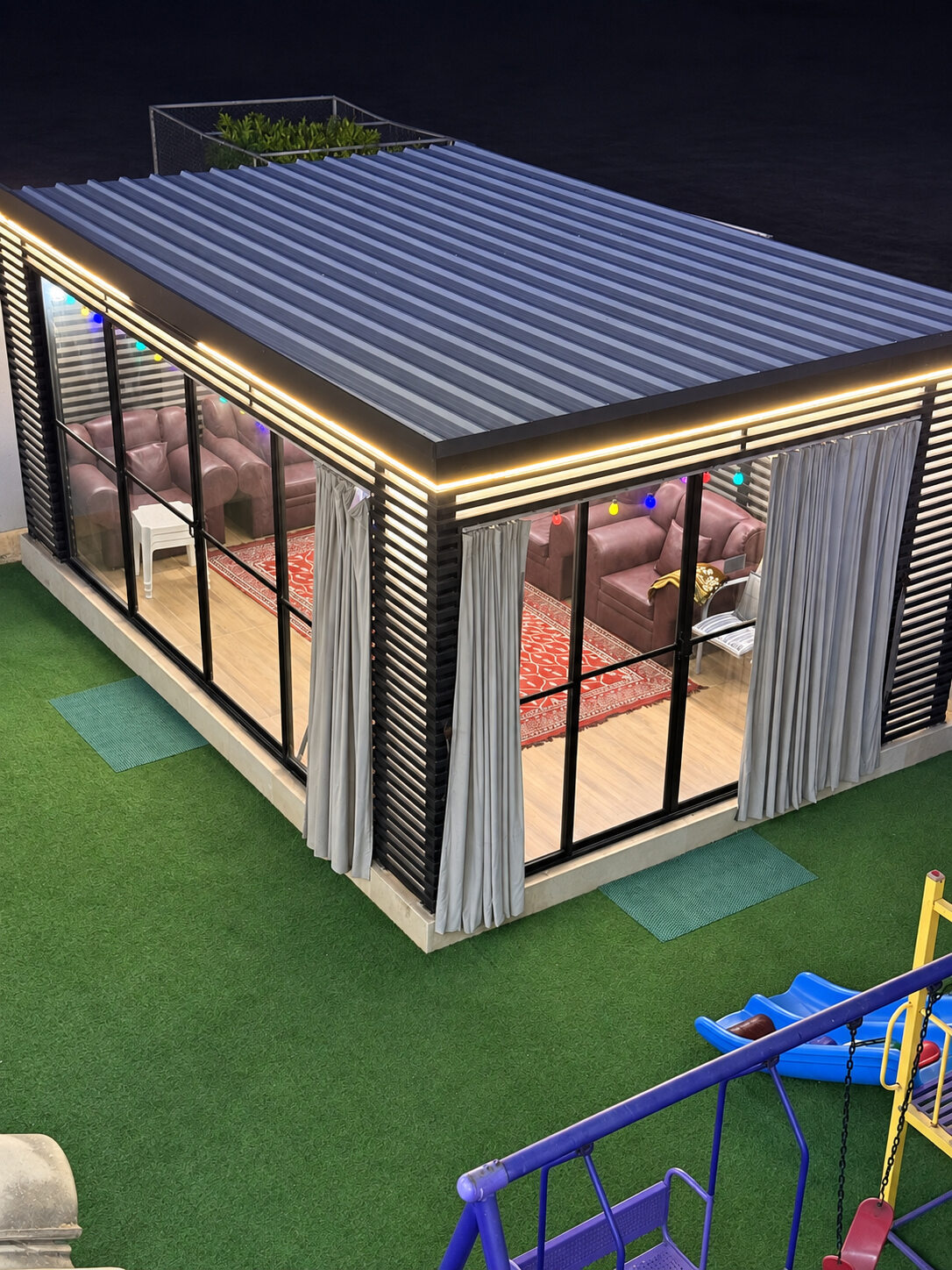 Glass-fronted garden lounge at Smart Chalet