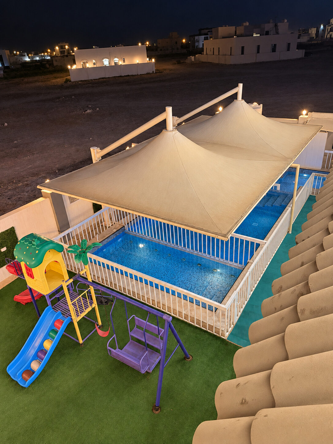 Pool and children’s play area viewed from above at Smart Chalet